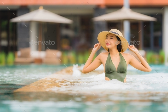 Portrait beautiful young asian woman relax in luxury outdoor swi - Stock Photo - Images