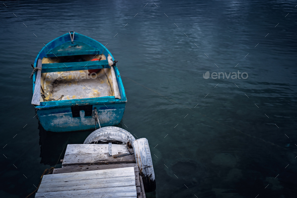 Small blue wooden rowing fisherman boat - Stock Photo - Images