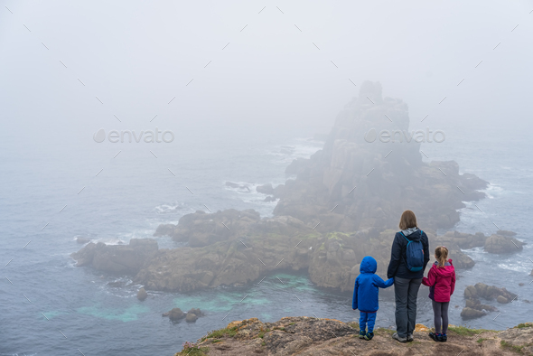 Family admiring landscape of the Lands End - Stock Photo - Images