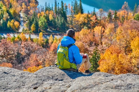 Backpacker man at Artist's Bluff in autumn - Stock Photo - Images