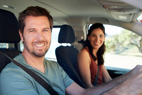 Smiling Mid Adult White Couple Driving In Their Car Smiling To Camera Close Up Side View Stock 5596