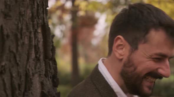 Handsome young couple walking in the autumn park