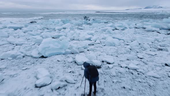 Drone Over Photographer on Diamond Beach Near Glacier Lagoon of Iceland alt