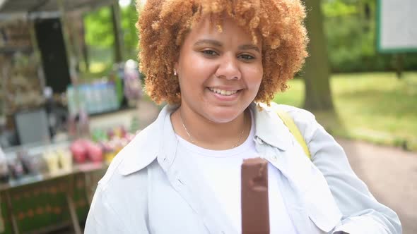 Lifestyle Portrait Of Smiling Young Naturally Beautiful Plus Size African American Woman With 