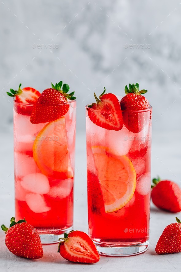 Refreshing Strawberry and lemon Iced Tea or lemonade in glasses