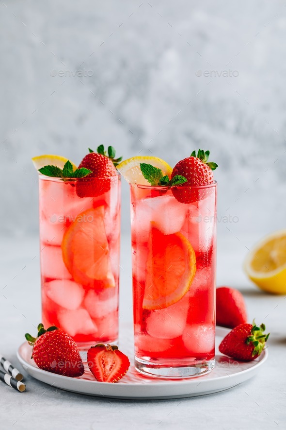 Refreshing Strawberry Mint and lemon Iced Tea or lemonade in glasses