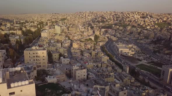 Overcast day in Amman Jordan with the sunlight filtering through for a beautiful aerial clip of the alt