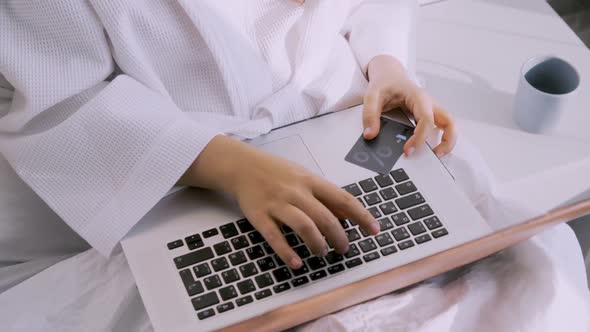 Woman Doing Online Shopping with Laptop