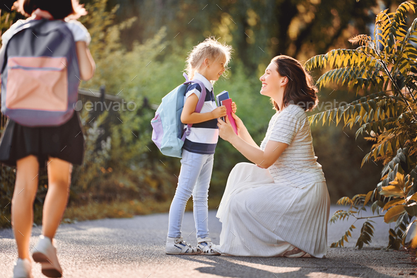 Parent and pupils go to school - Stock Photo - Images