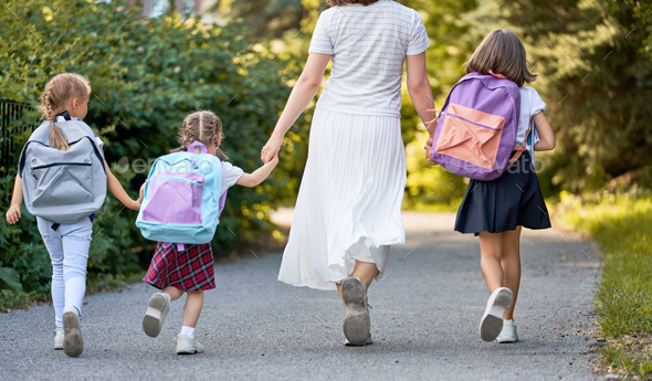 Parent and pupils are going to school - Stock Photo - Images