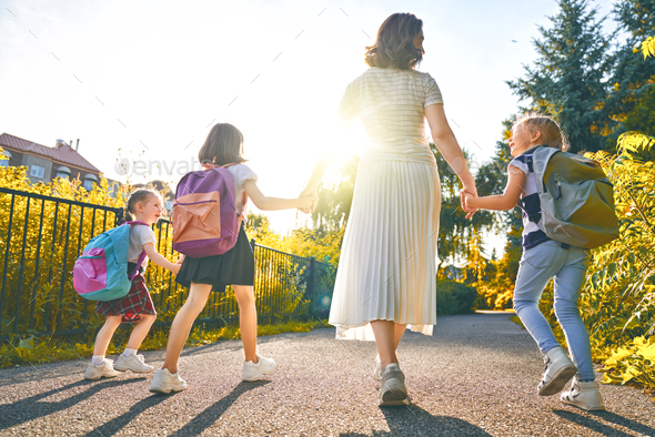 Parent and pupils are going to school - Stock Photo - Images