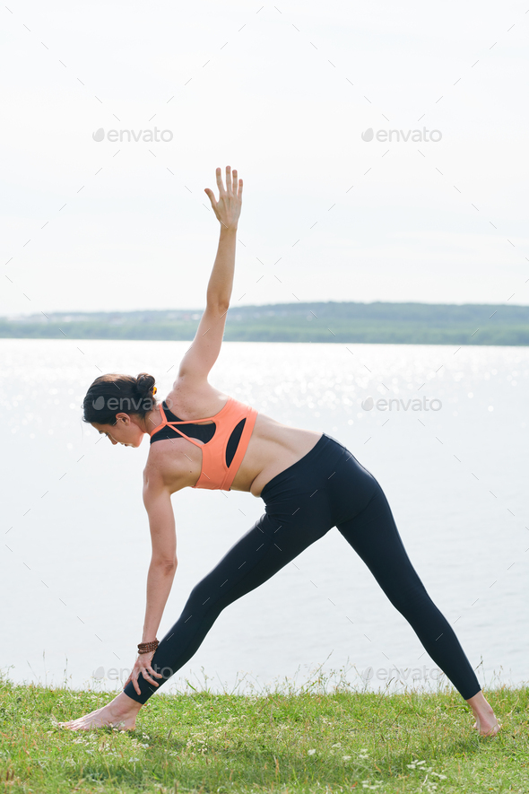Young Japanese Woman Doing YOGA Extended Triangle Pose Stock Photo - Image  of human, adult: 44210912