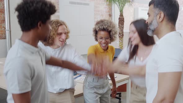 Group of Young Multiethnic Entrepreneurs Celebrating Business Success alt