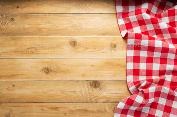 cloth napkin at rustic wooden background, top view Stock Photo by seregam