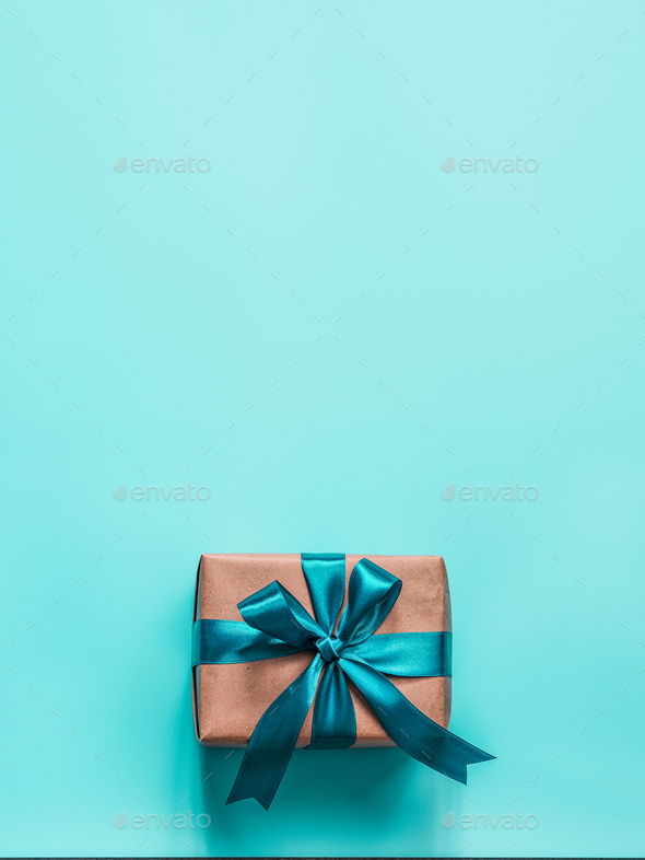 Gift box in craft paper and satin ribbon - Stock Photo - Images