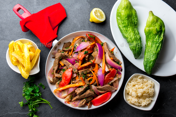 Peruvian dish Lomo saltado - beef tenderloin with vegetables - Stock Photo - Images