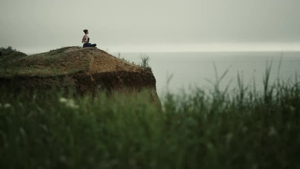 Far View Yoga Woman Exercising on Hill Top alt