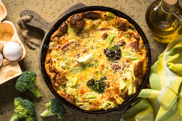 Frittata with sausage and vegetables in skillet