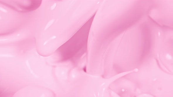 Super Slow Motion Shot of Pouring and Splashing Strawberry Milk at 1000Fps alt