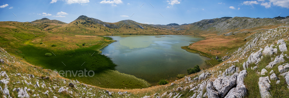 Panoramic photo of Stirinsko lake in Dinaric Alps - Stock Photo - Images