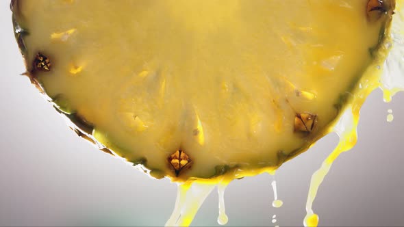 Flowing Pineapple Juice From Pineapple Slice Macro Shot in Slow Motion alt