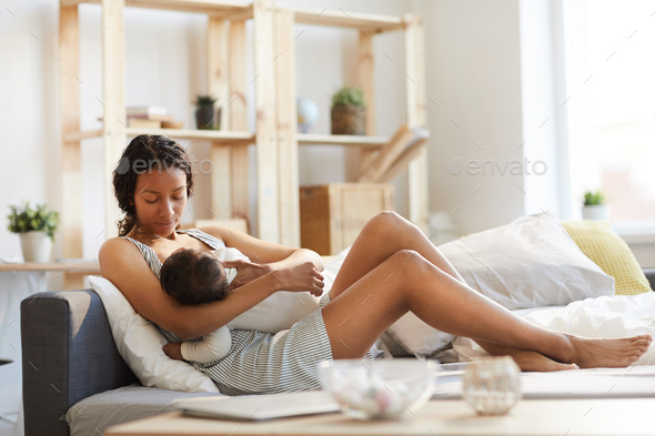 beautiful mom breastfeeding baby