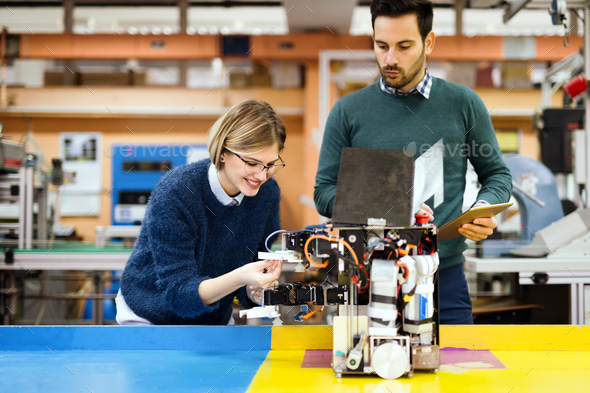 Young students of robotics working on project - Stock Photo - Images