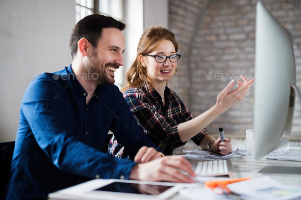 Young architects working on project in office - Stock Photo - Images