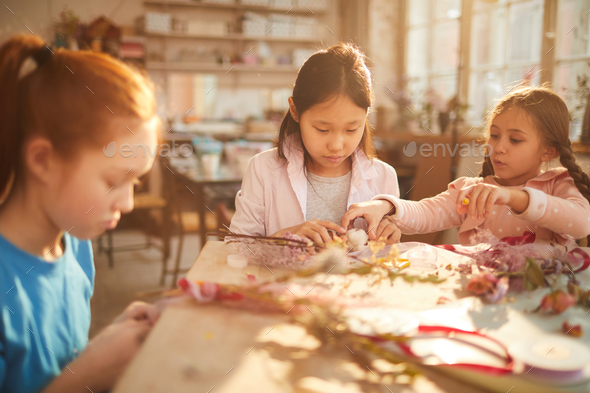 Girls Making Flower Wraths - Stock Photo - Images