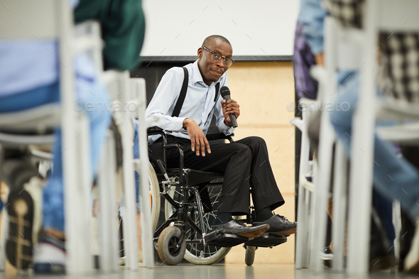 Successful disabled black scientist addressing conference - Stock Photo - Images