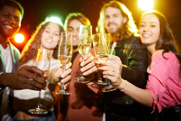 Drinking champagne at party in nightclub - Stock Photo - Images