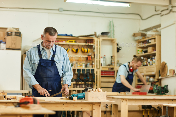 Carpenters Assembling Furniture - Stock Photo - Images