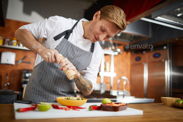 Professional Chef Seasoning Dish - Stock Photo - Images