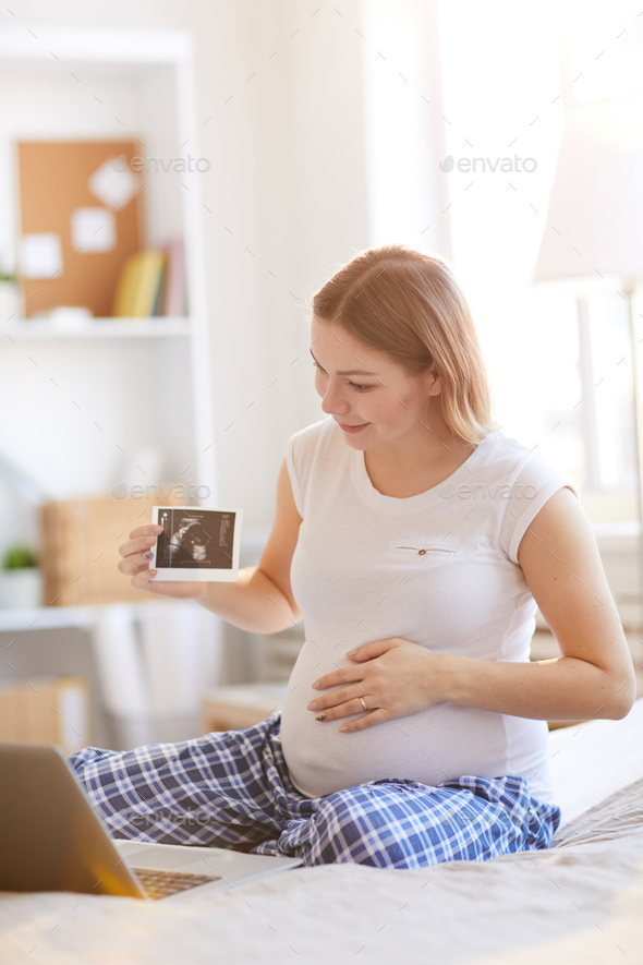 Pregnant Woman Calling by Video chat - Stock Photo - Images