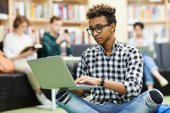 Black student boy preparing research - Stock Photo - Images