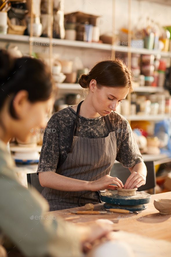 Concentrated potter moulding clay bowl - Stock Photo - Images