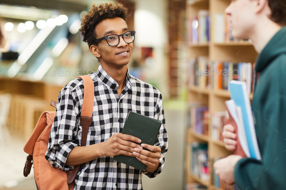 Asking advice about scientific literature from groupmate - Stock Photo - Images