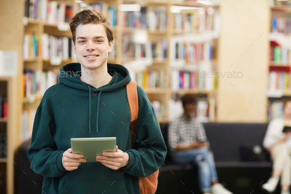 Cheerful high school student with tablet - Stock Photo - Images