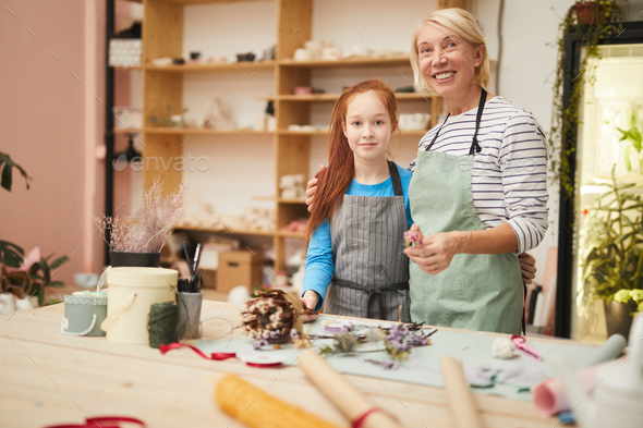 Female Florist Posing with Teenage Girl - Stock Photo - Images