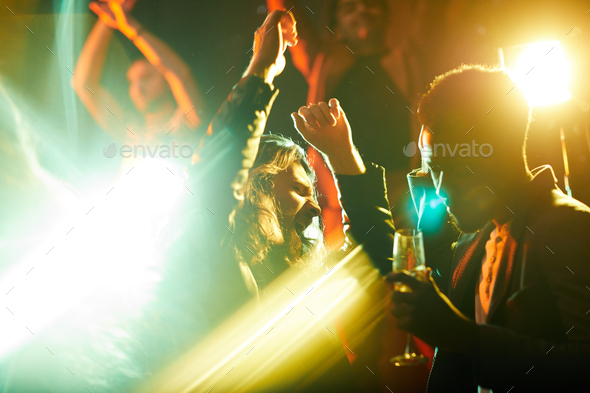 Emotional man dancing and singing at party - Stock Photo - Images