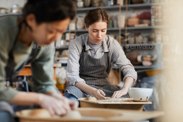 Potter concentrated on work - Stock Photo - Images