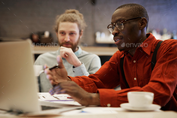 Young African Businessman Using Laptop - Stock Photo - Images