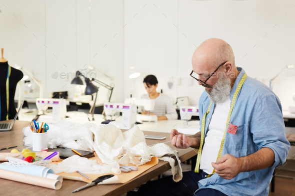 Working by table - Stock Photo - Images