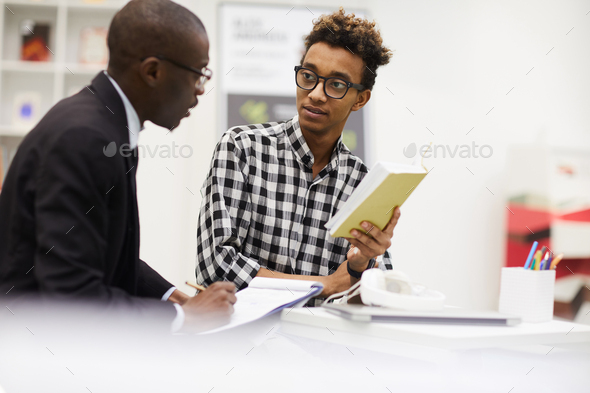 Black guys discussing ideas for project - Stock Photo - Images