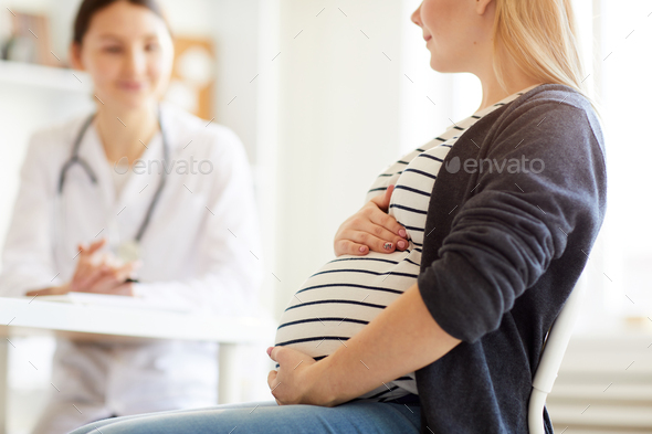 Pregnant Woman Consulting Doctor - Stock Photo - Images