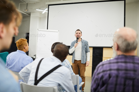 Startup entrepreneur presenting his project at conference - Stock Photo - Images