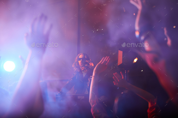Popular dj playing at party - Stock Photo - Images