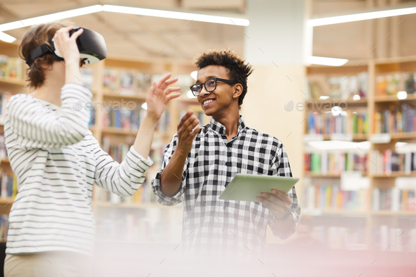 Student presenting 3D model of his equipment using VR simulator - Stock Photo - Images