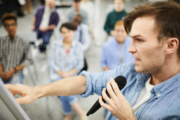 Confident man telling about powerful sales tools - Stock Photo - Images