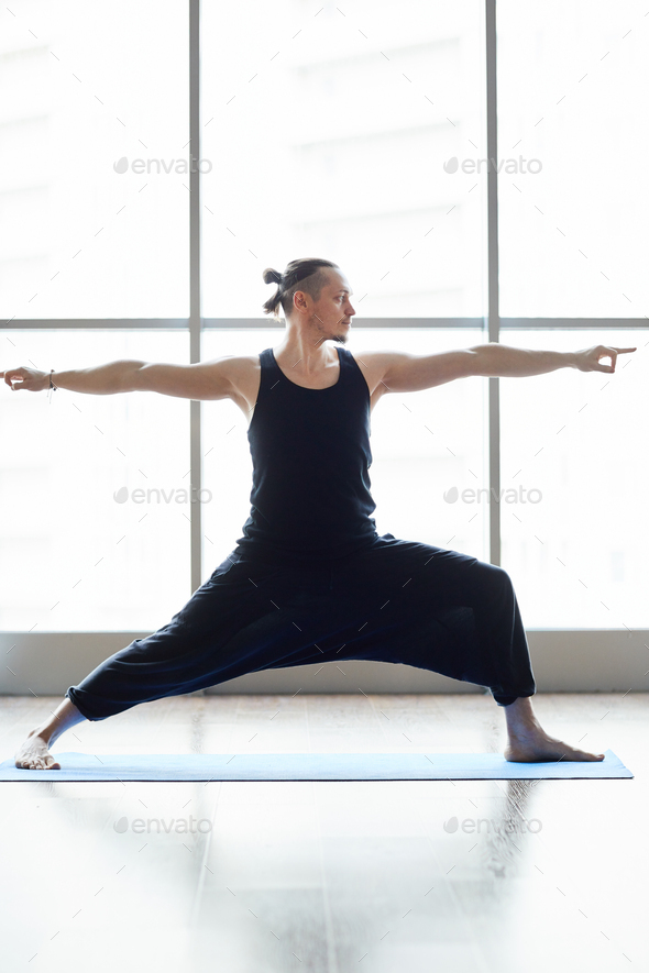 Yogis doing balance exercise - Stock Photo - Images